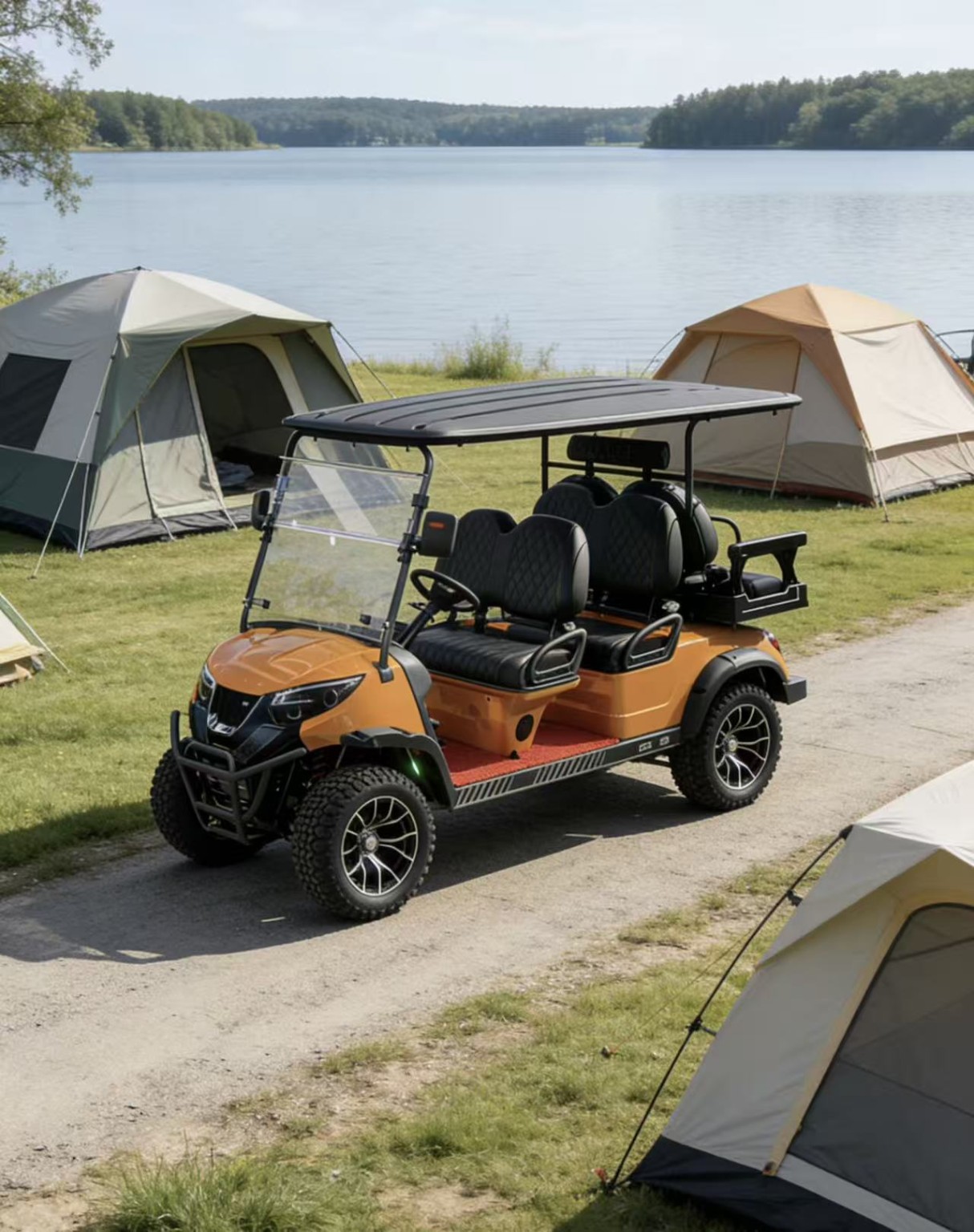 Orange golf cart beside tents at a lakeside campsite